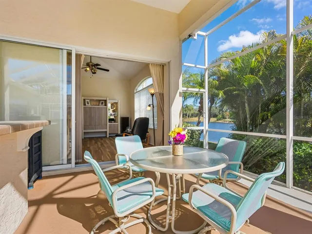 a dining room with furniture window and wooden floor