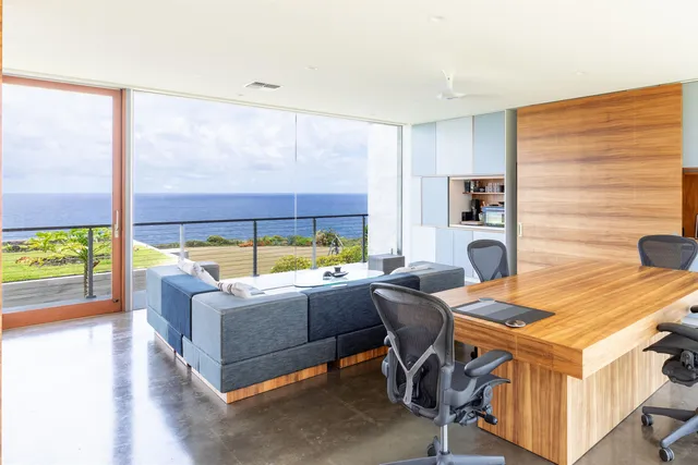 a work room with furniture and a window