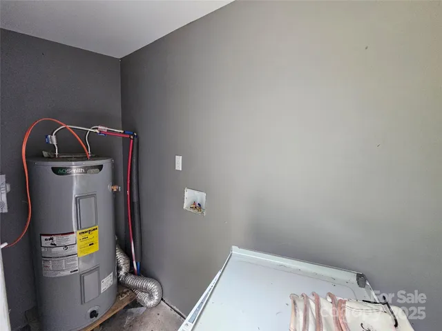 a view of storage and utility room with a sink