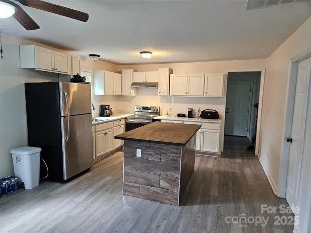 a kitchen with a refrigerator a sink and dishwasher