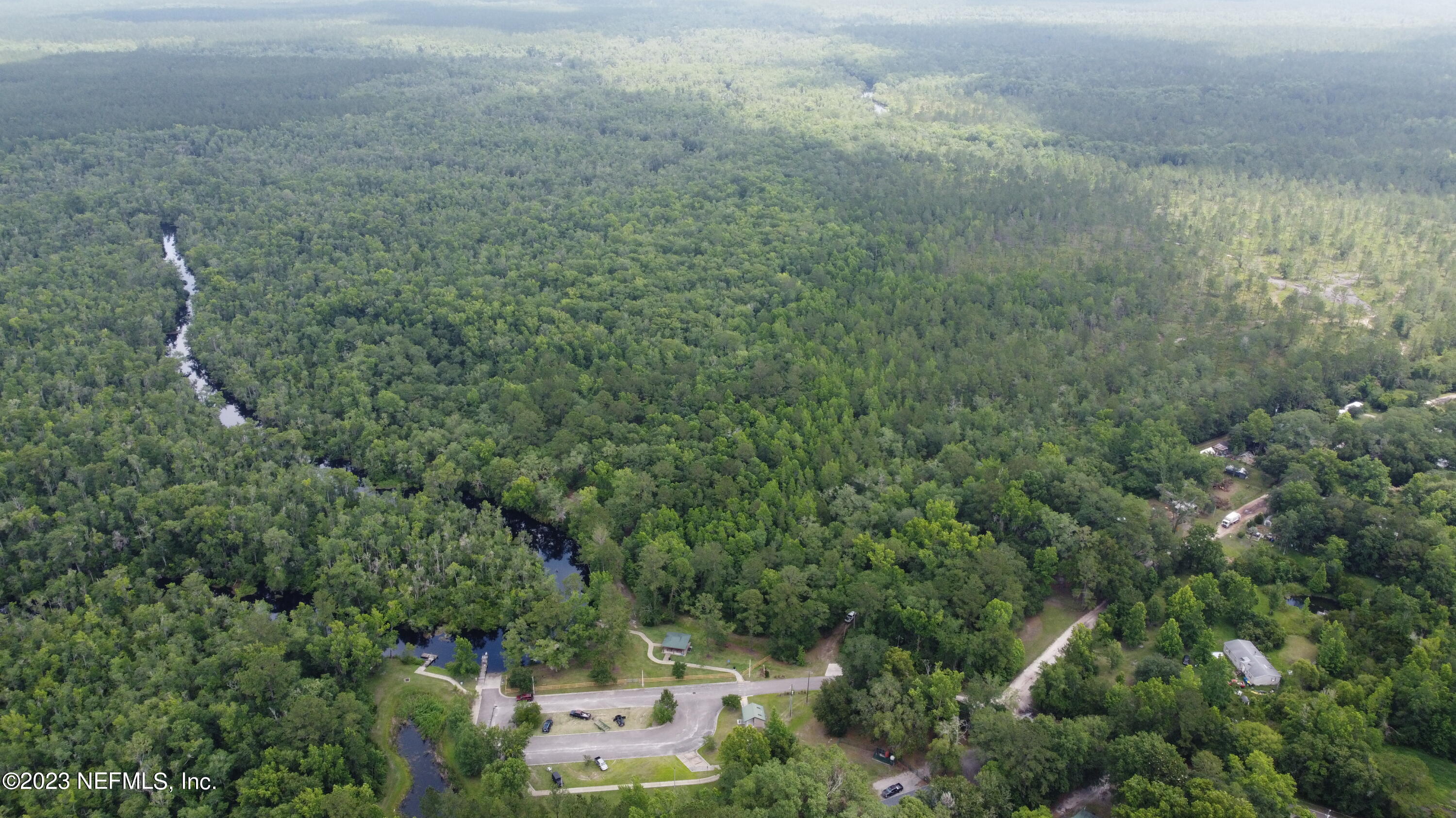 0 Ethel Road Jacksonville, FL 32218 - Photo 6 of 24 a view of a forest with a street