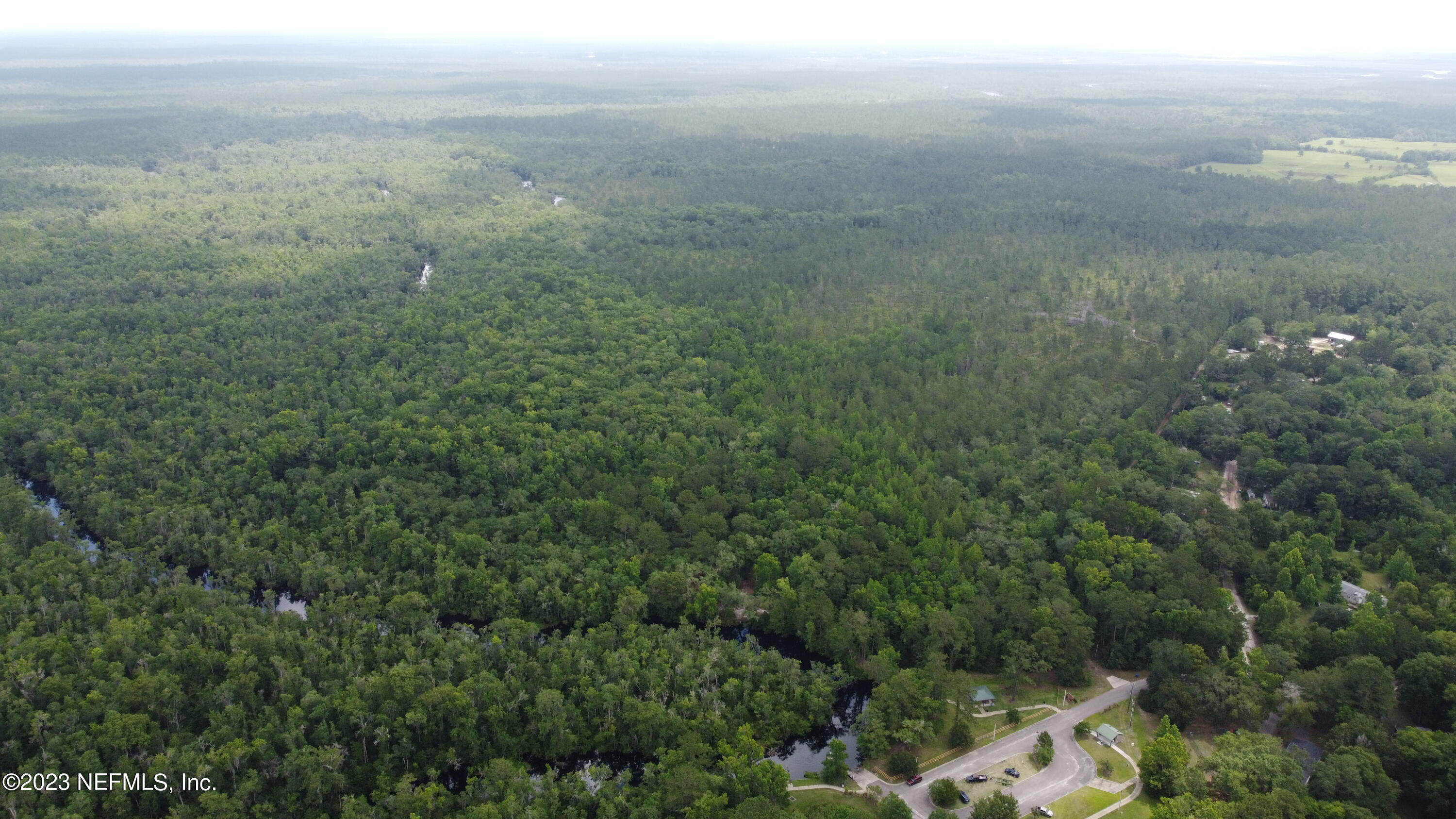 0 Ethel Road Jacksonville, FL 32218 - Photo 7 of 24 a view of a field of grass and trees