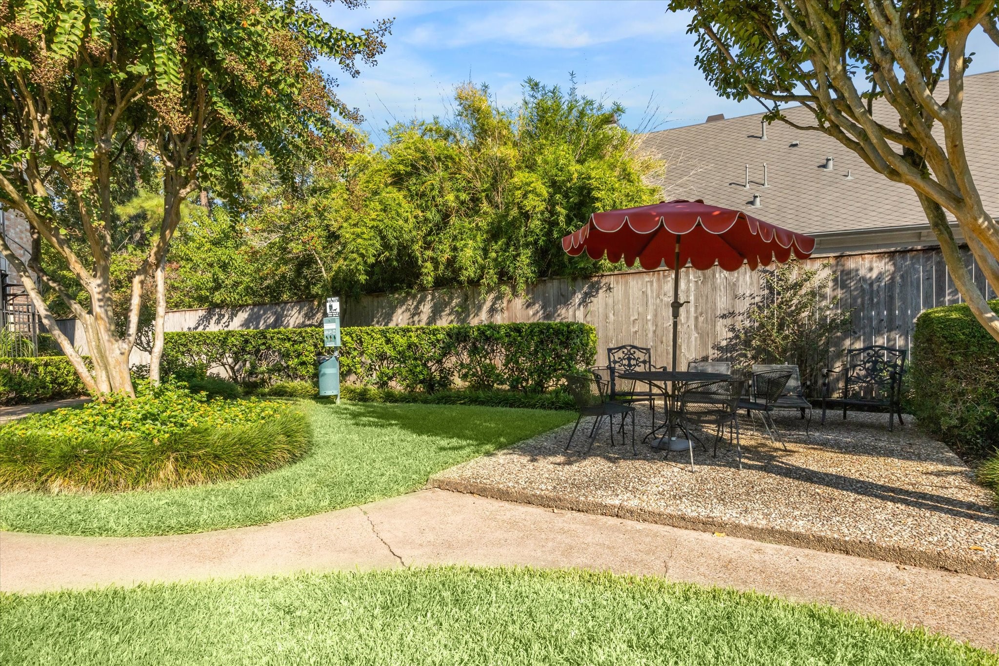 2238 South Piney Point Road, Unit 204 Houston, TX 77063 - Photo 11 of 14 a view of a table and chairs under an umbrella