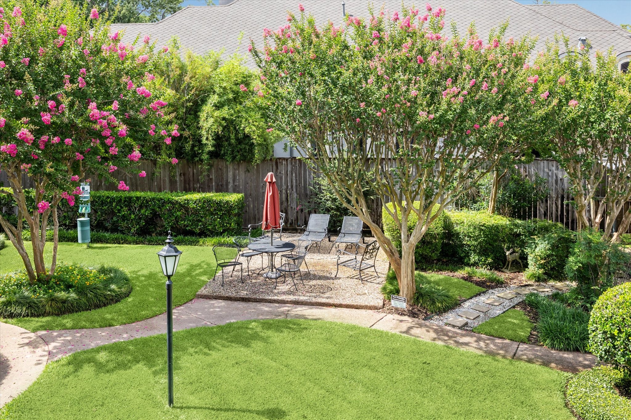 2238 South Piney Point Road, Unit 204 Houston, TX 77063 - Photo 14 of 14 a view of a chair and table in the garden