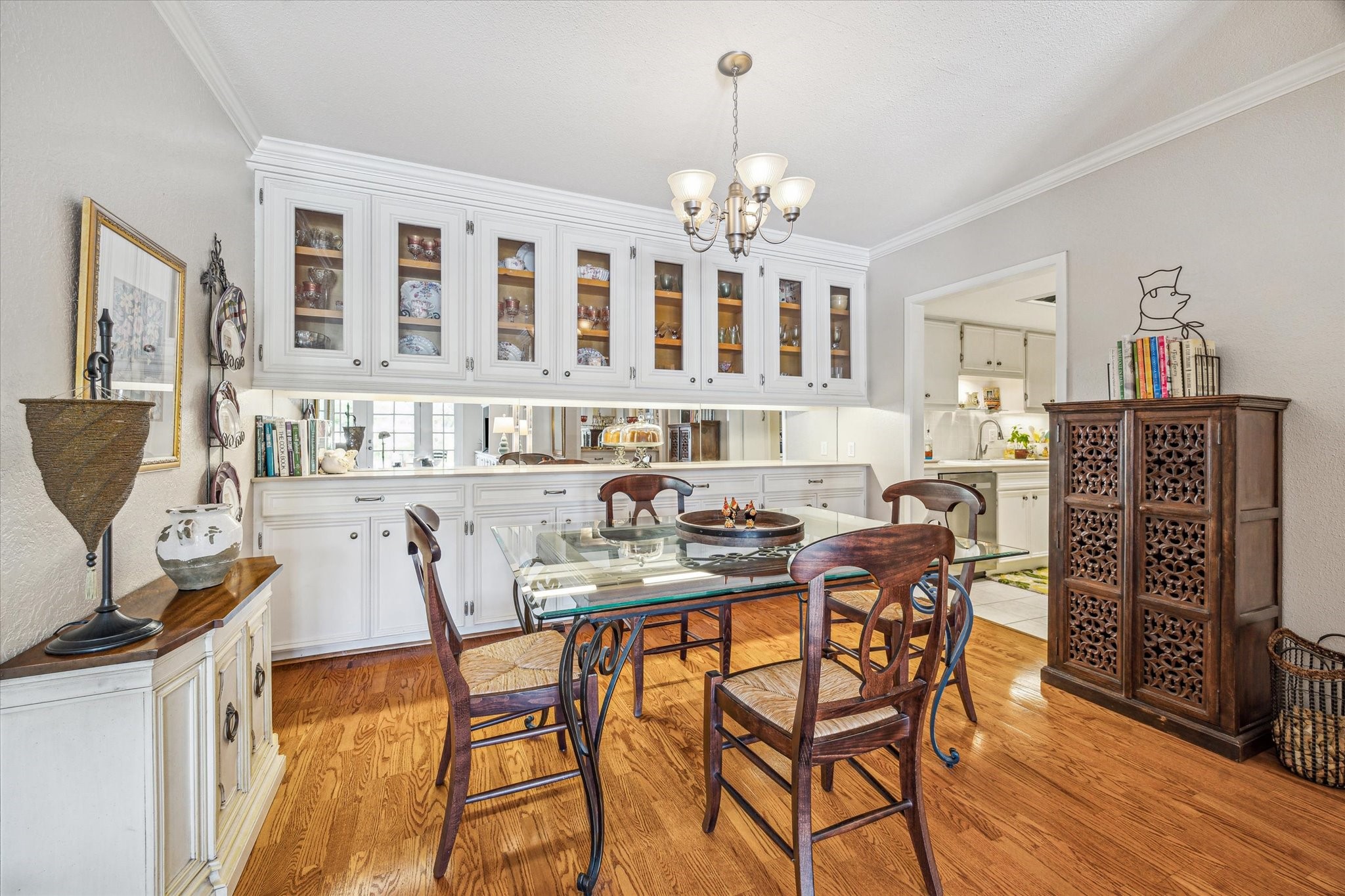2238 South Piney Point Road, Unit 204 Houston, TX 77063 - Photo 3 of 14 a view of a dining room with furniture and chandelier