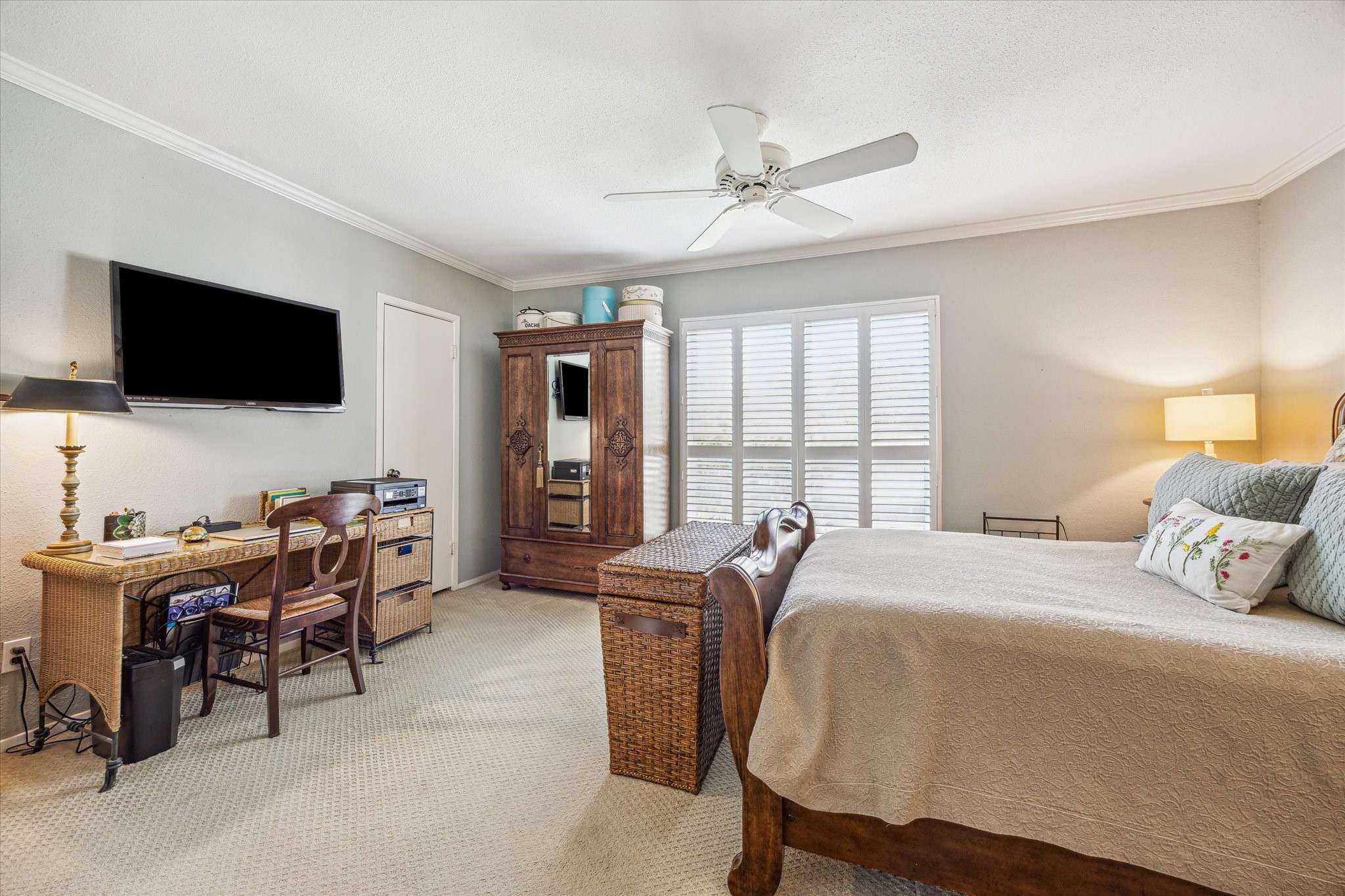 2238 South Piney Point Road, Unit 204 Houston, TX 77063 - Photo 6 of 14 a bedroom with a bed and a flat screen tv