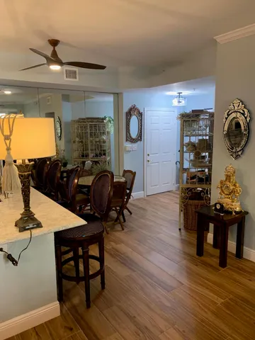 a view of a dining room with furniture and wooden floor