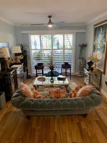 a room with furniture and large windows