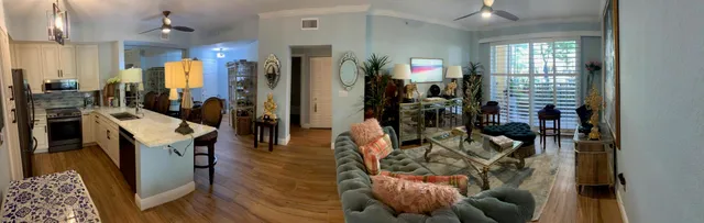 a view of a living room and dining room