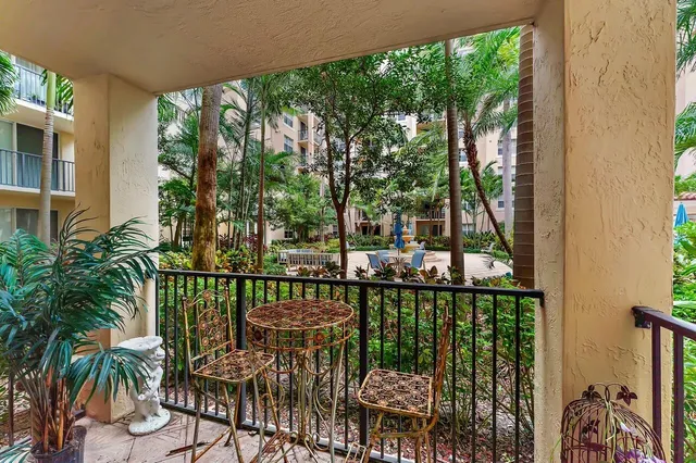 a view of a balcony with lake view and a potted plant