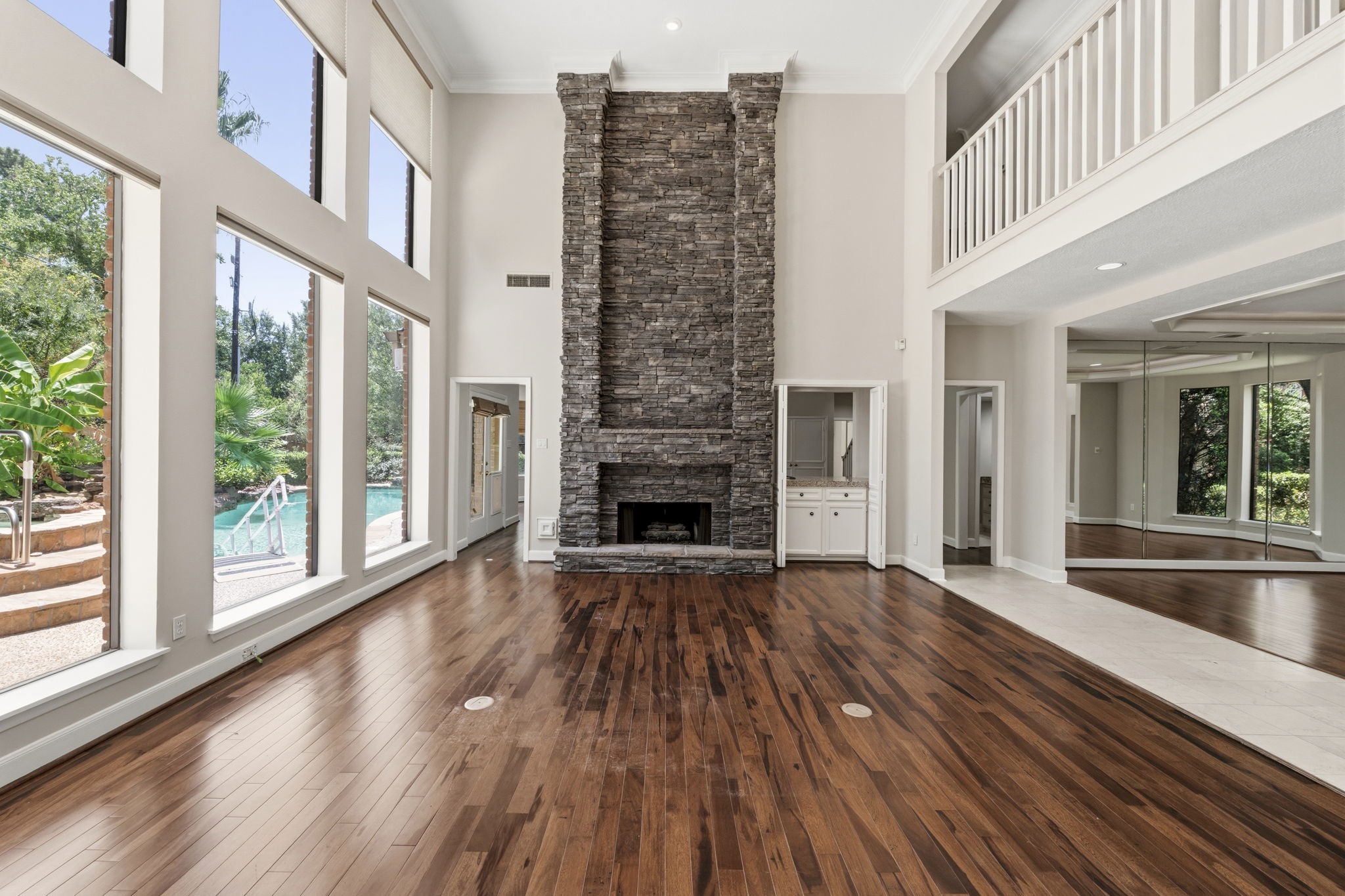 18503 Cabaniss Circle Spring, TX 77379 - Photo 12 of 49 A striking floor-to-ceiling stacked stone fireplace serves as the architectural centerpiece of the home's main gathering space.