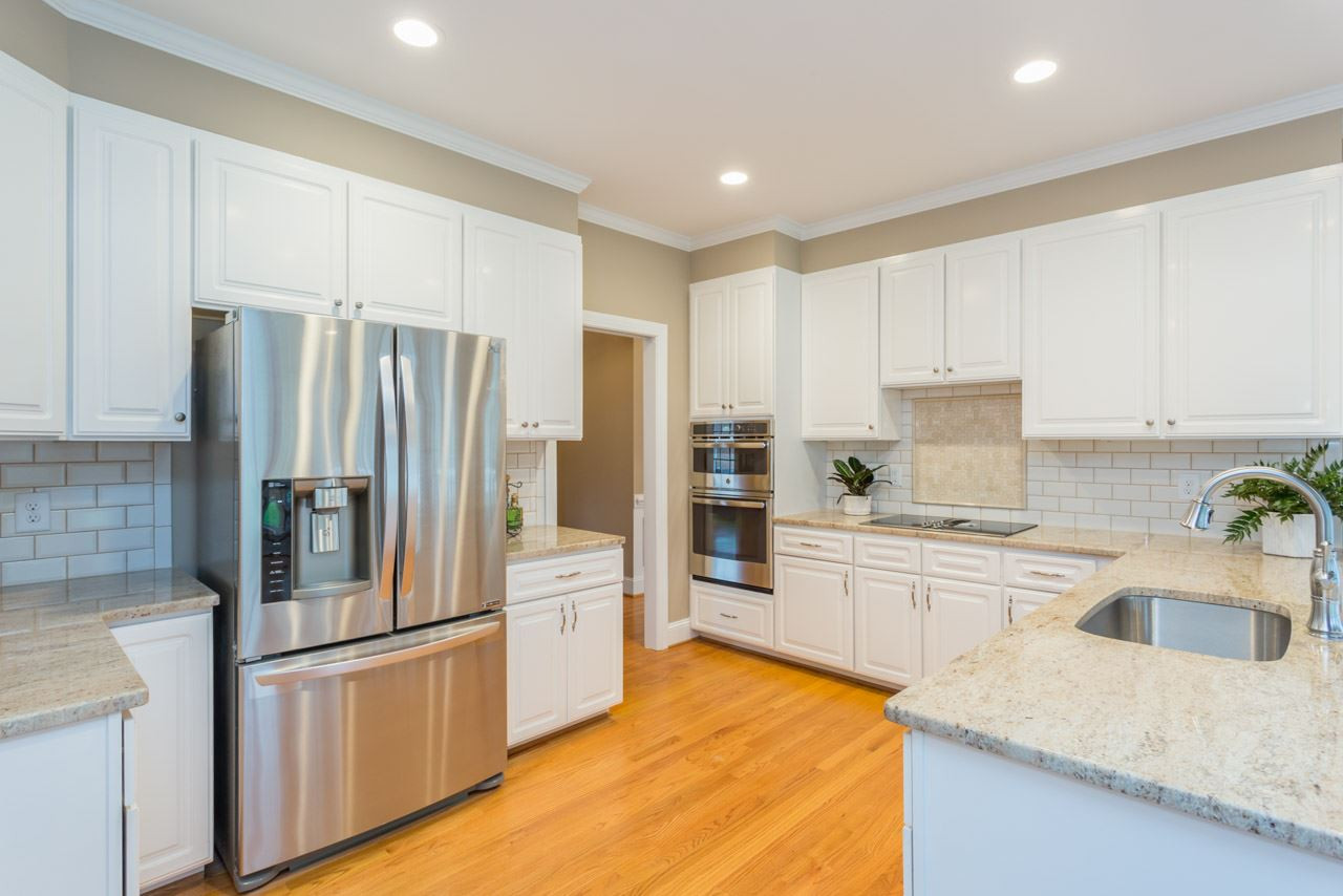 8704 Carriage Tour Lane Raleigh, NC 27615 - Photo 12 of 25 All new stainless applilances plus new hardwoods. Kitchen