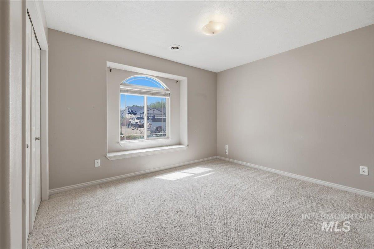 1068 Locksley Street Middleton, ID 83644 - Photo 15 of 30 Arch-top window with a deep sill and neutral wall tones