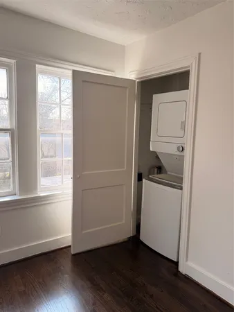 a room with a hardwood and a window