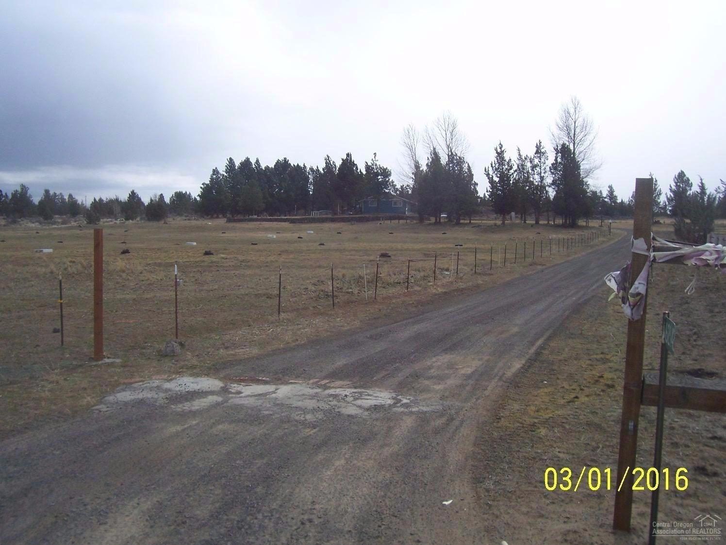 62142 Cody Jr Road Bend, OR 97701 - Photo 18 of 18 View from road down driveway. Home is in