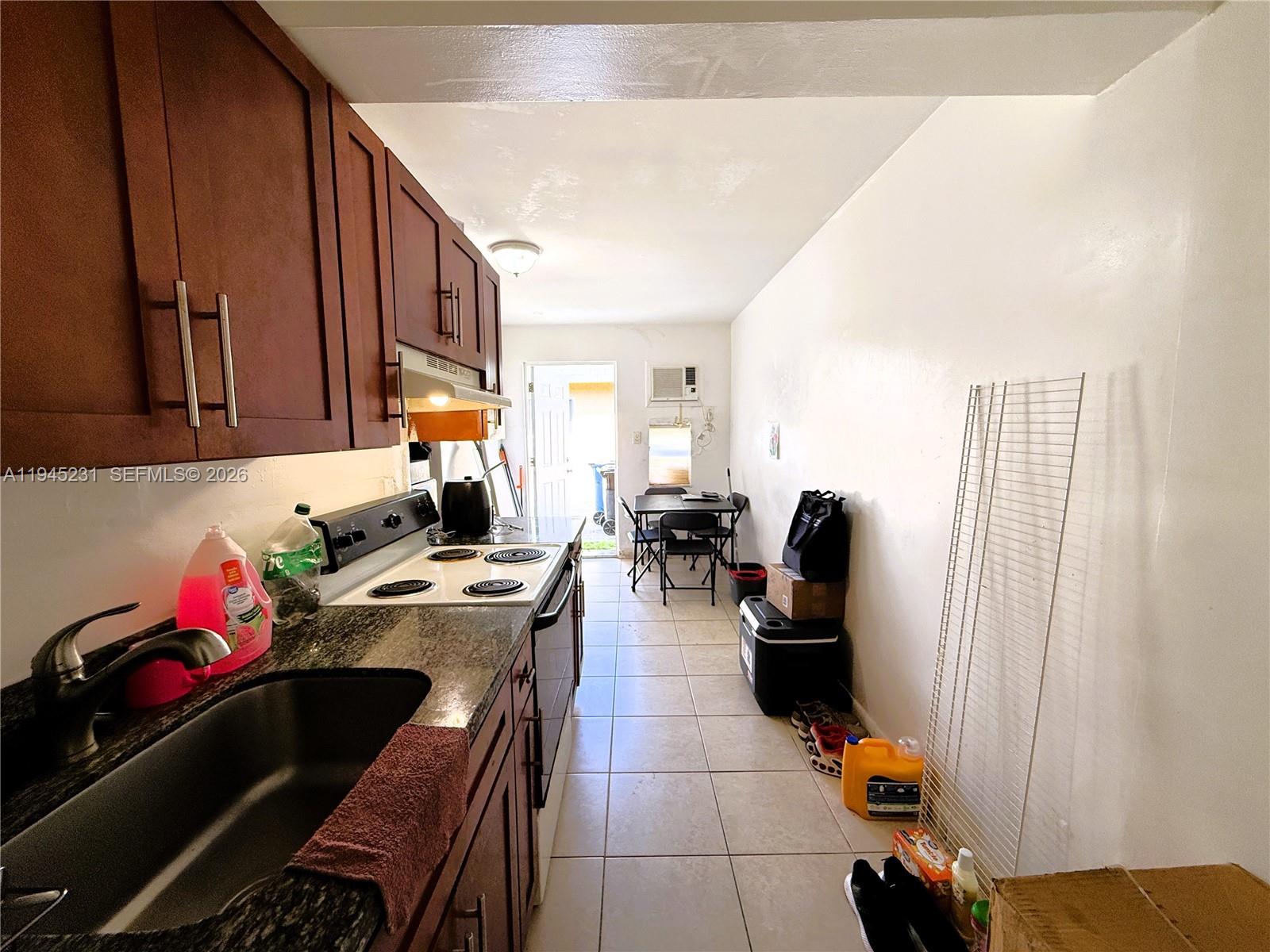 635 Northwest 22nd Road Fort Lauderdale, FL 33311 - Photo 12 of 20 a kitchen with a sink appliances and cabinets