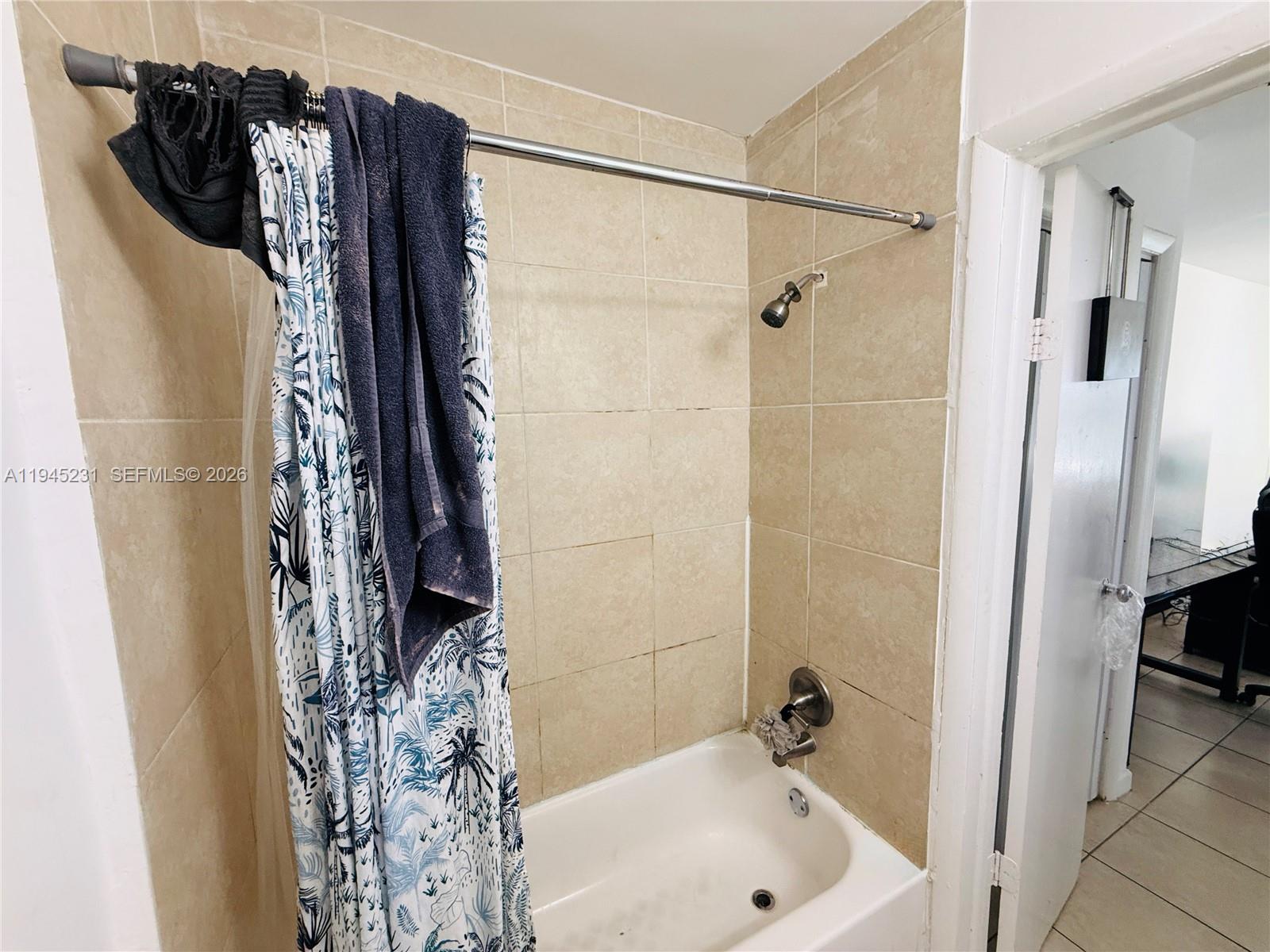 635 Northwest 22nd Road Fort Lauderdale, FL 33311 - Photo 17 of 20 a bathroom with a shower and a tub