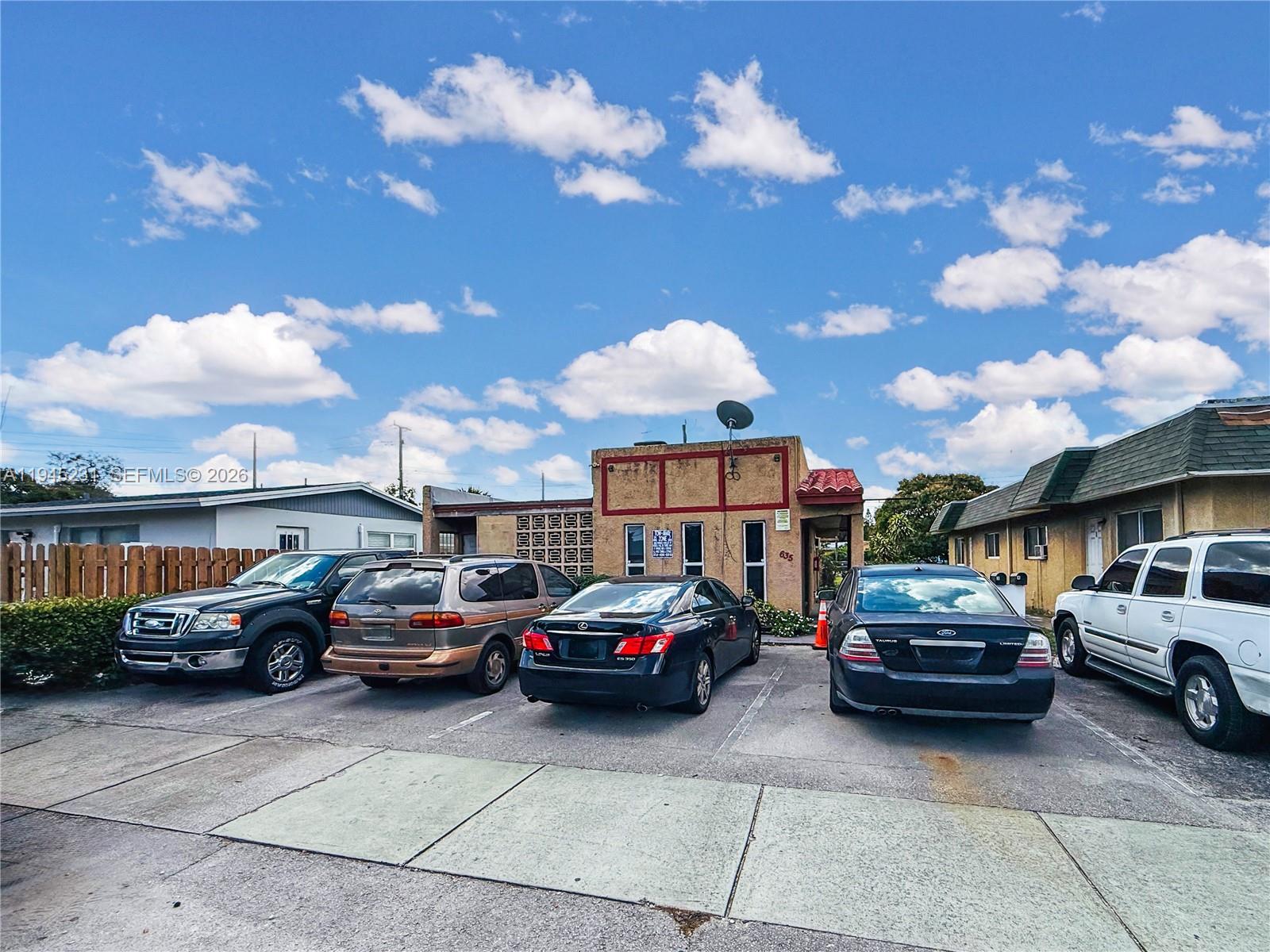 635 Northwest 22nd Road Fort Lauderdale, FL 33311 - Photo 2 of 20 a view of cars parked in front of a building