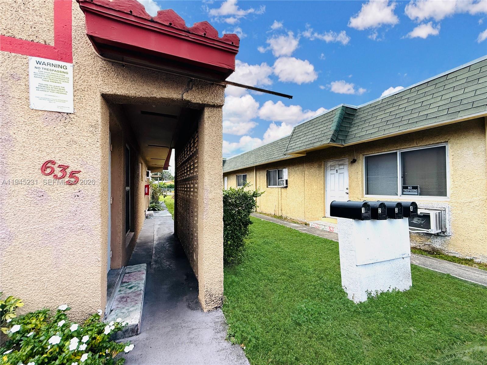 635 Northwest 22nd Road Fort Lauderdale, FL 33311 - Photo 4 of 20 a view of a house with a yard