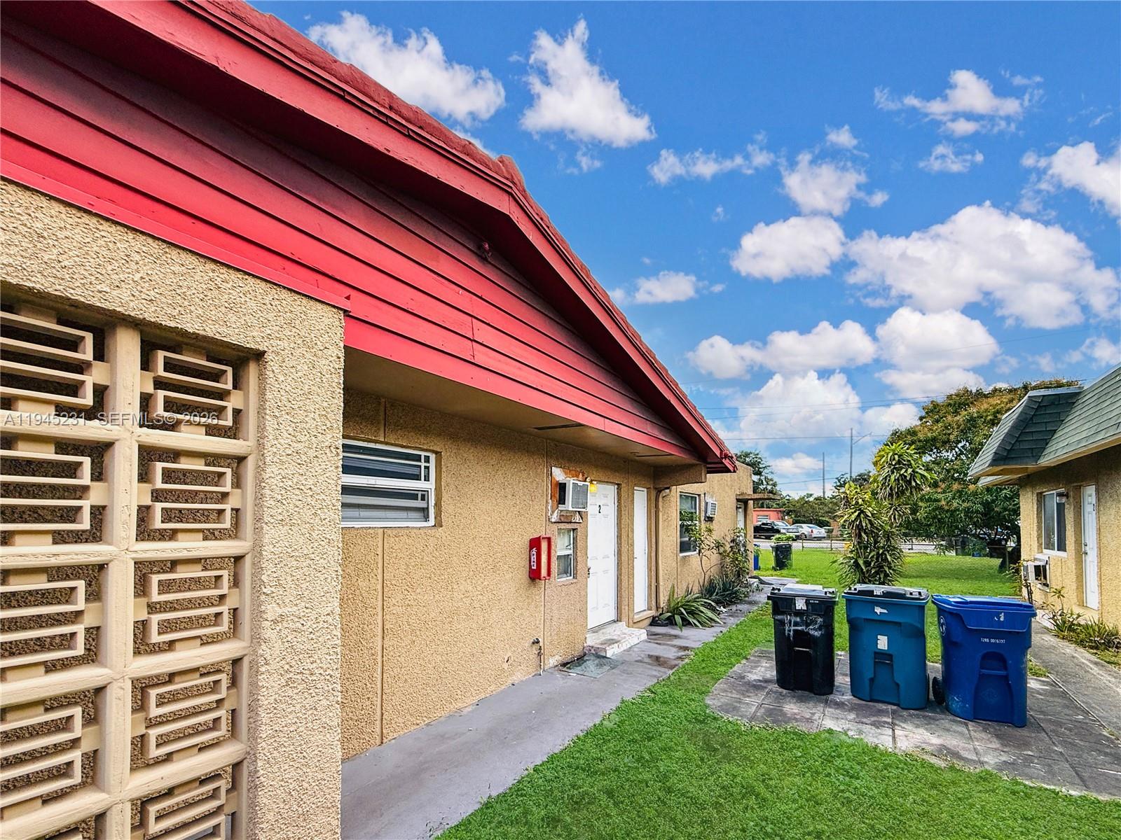 635 Northwest 22nd Road Fort Lauderdale, FL 33311 - Photo 5 of 20 a front view of a house with a garden