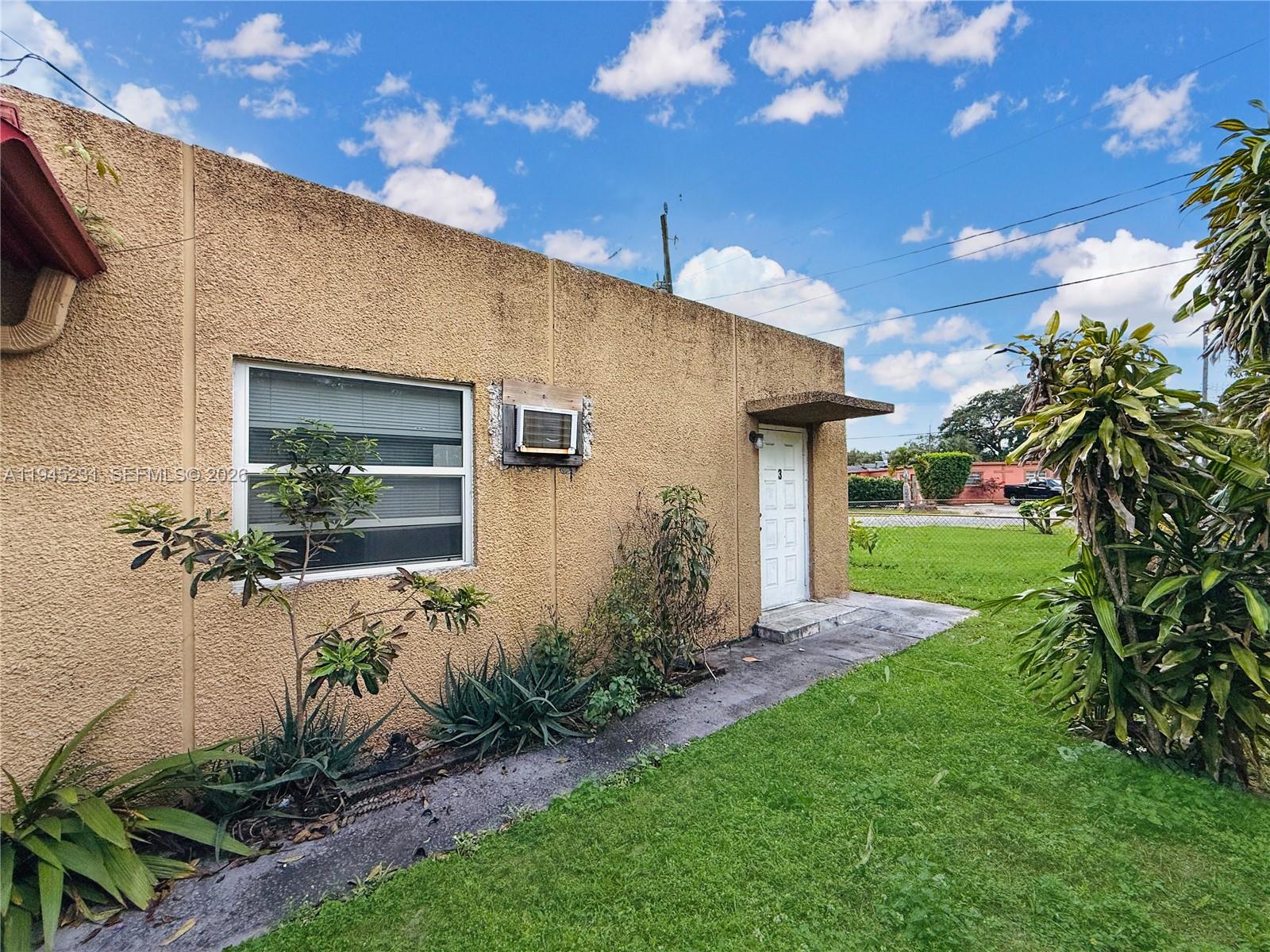 635 Northwest 22nd Road Fort Lauderdale, FL 33311 - Photo 6 of 20 a front view of a house with garden