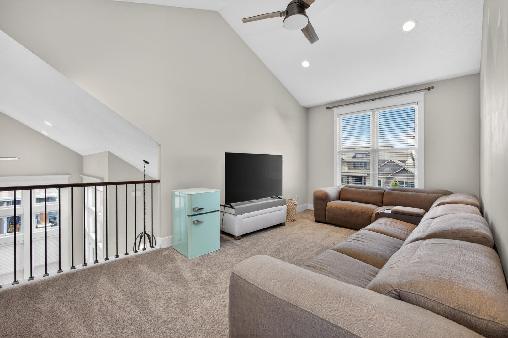 5700 Emily Road Bettendorf, IA 52722 - Photo 19 of 58 a living room with furniture and a flat screen tv