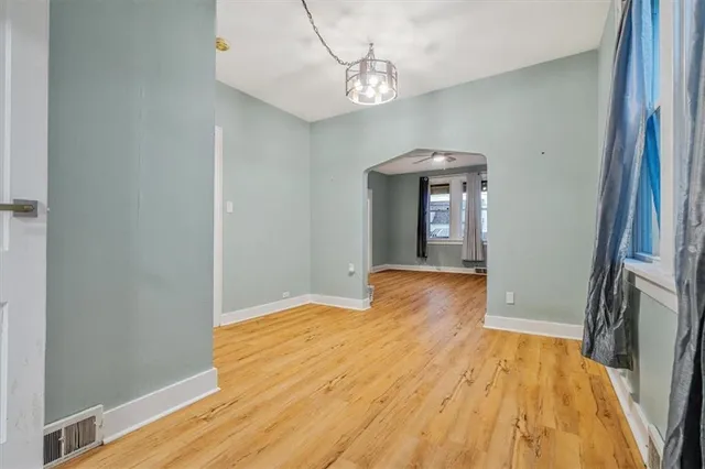 a view of a room with wooden floor and staircase