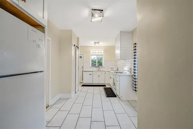 a bathroom with a sink a toilet and a shower