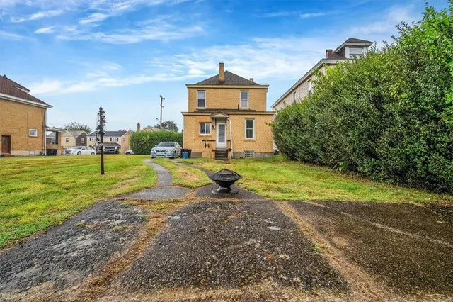 a aerial view of a house with a yard