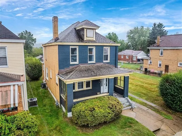 an aerial view of a house with a garden