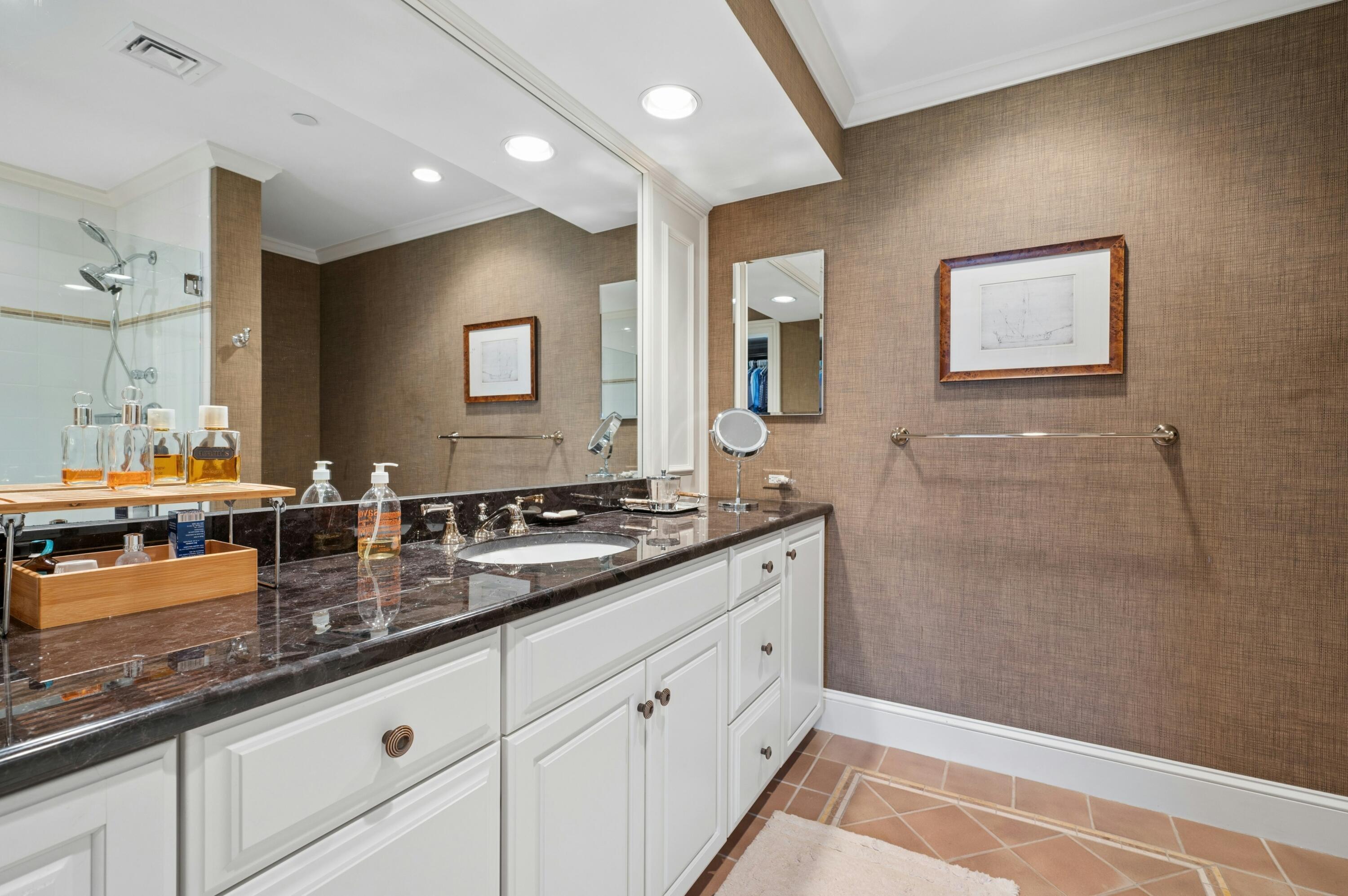23 Snow Inn Road, Unit 7 Harwich Port, MA 02646 - Photo 19 of 37 a spacious bathroom with double vanity a mirror and shower