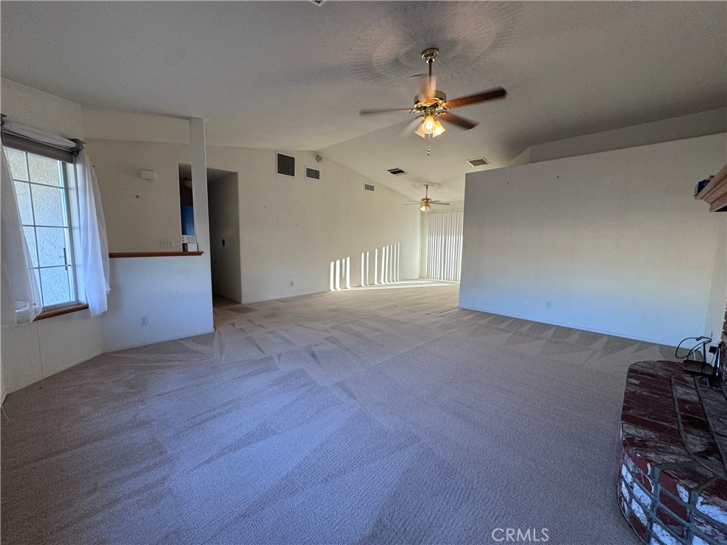 400 Vista Street Ridgecrest, CA 93555 - Photo 15 of 32 a view of a livingroom with a ceiling fan and window