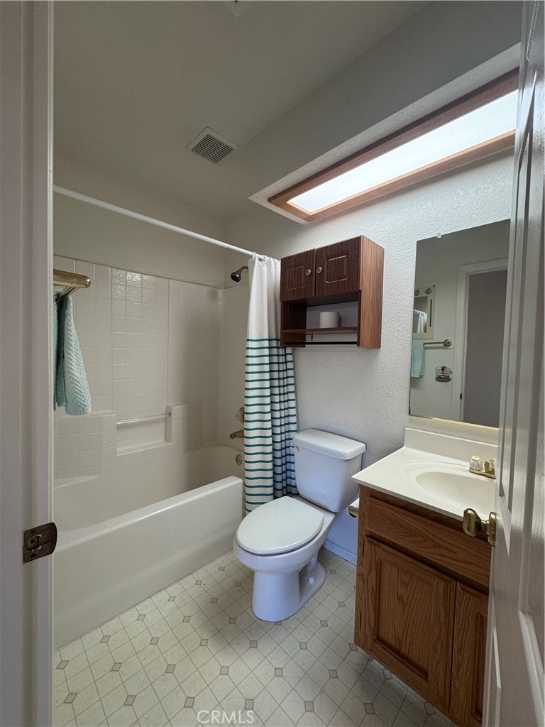 400 Vista Street Ridgecrest, CA 93555 - Photo 27 of 32 a bathroom with a sink a toilet and shower