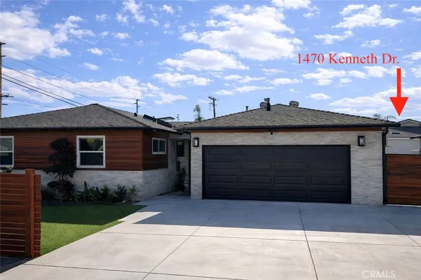 a front view of a house with a garage