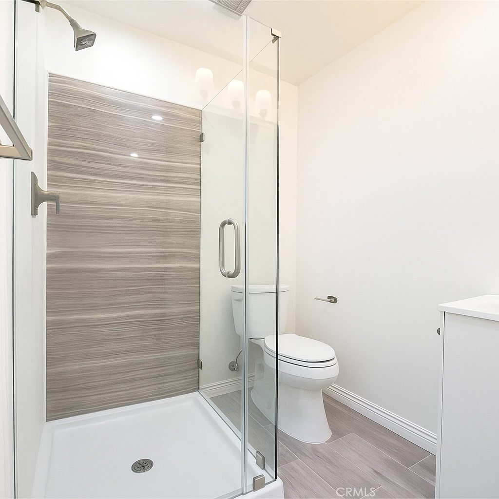 1470 Kenneth Drive Tustin, CA 92780 - Photo 3 of 3 a bathroom with a shower and a toilet