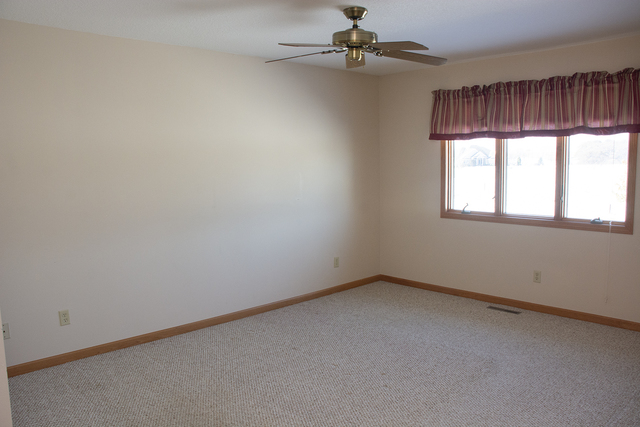 15479 Henry Road, Unit B Morrison, IL 61270 - Photo 11 of 18 an empty room with a window