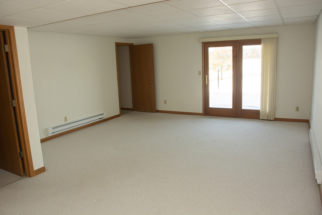 15479 Henry Road, Unit B Morrison, IL 61270 - Photo 15 of 18 an empty room with windows
