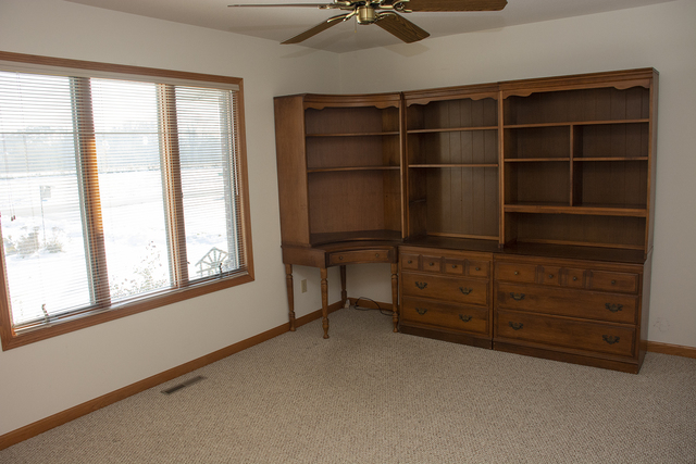 15479 Henry Road, Unit B Morrison, IL 61270 - Photo 4 of 18 a room with furniture and windows
