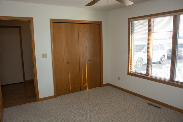 15479 Henry Road, Unit B Morrison, IL 61270 - Photo 5 of 18 an empty room with windows