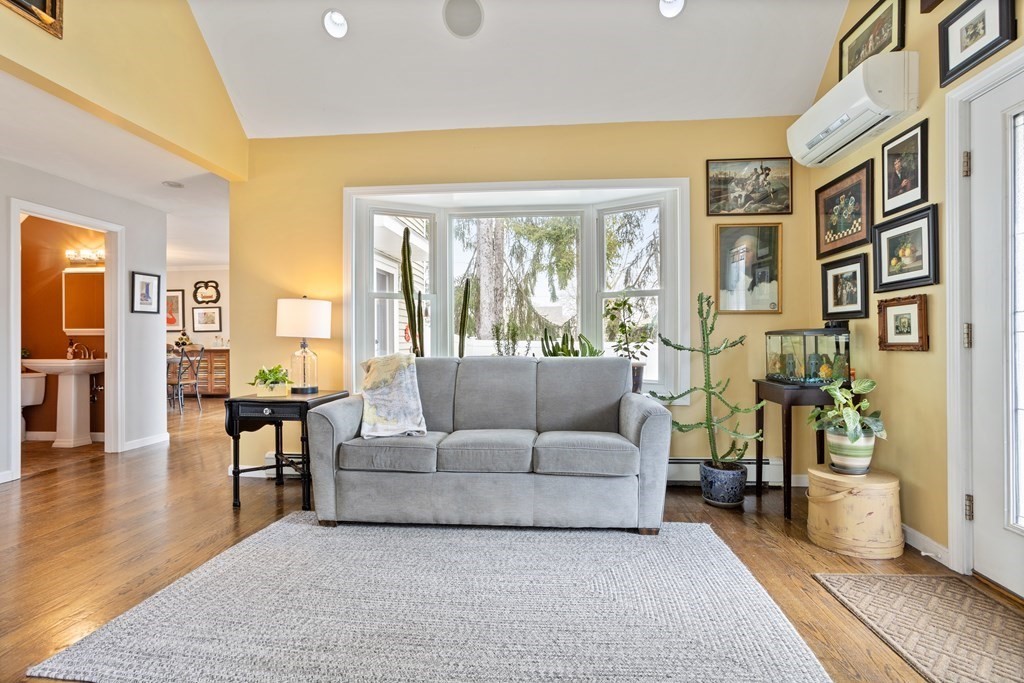 114 River Street Hudson, MA 01749 - Photo 14 of 40 a living room with furniture and floor to ceiling windows
