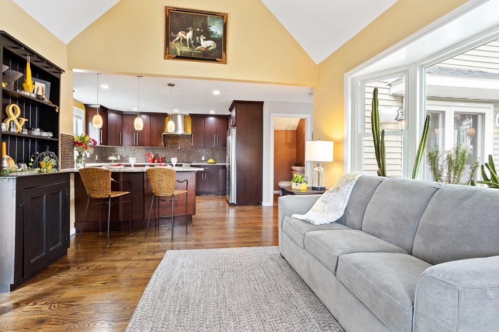 114 River Street Hudson, MA 01749 - Photo 15 of 40 a living room with stainless steel appliances furniture a rug and a large window