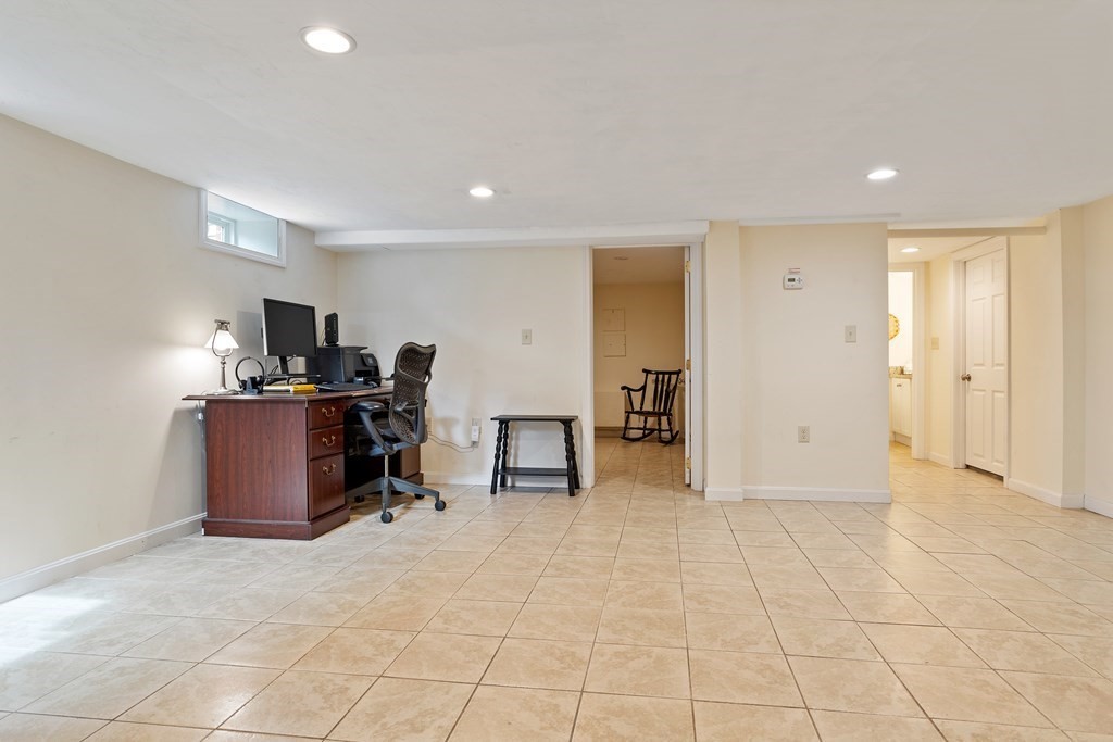 114 River Street Hudson, MA 01749 - Photo 18 of 40 a view of a room with workspace and windows