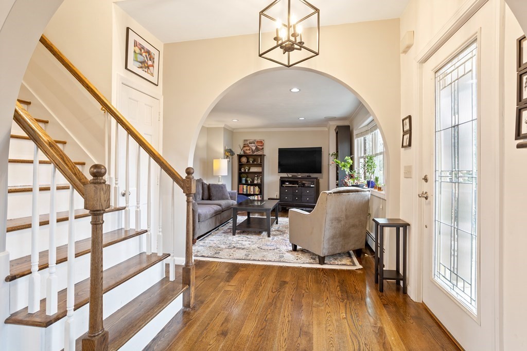 114 River Street Hudson, MA 01749 - Photo 2 of 40 a living room with furniture and a flat screen tv