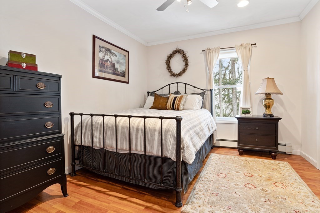 114 River Street Hudson, MA 01749 - Photo 21 of 40 a bed room with a bed and a window