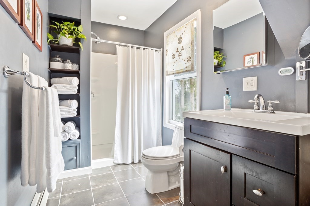 114 River Street Hudson, MA 01749 - Photo 26 of 40 a bathroom with a sink toilet and shower