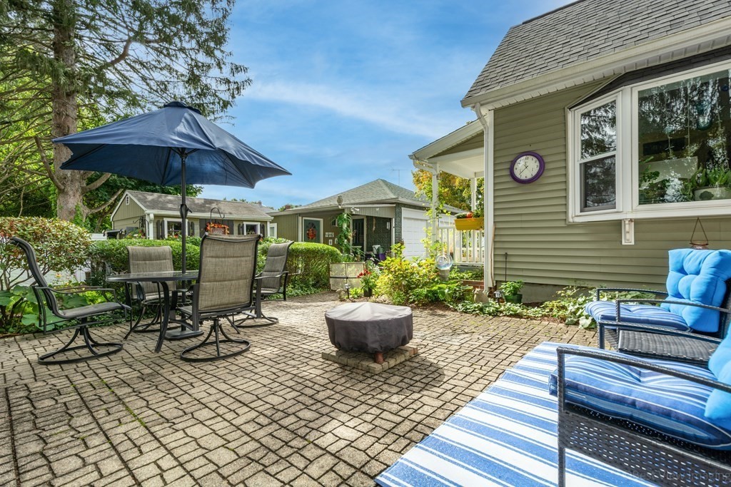 114 River Street Hudson, MA 01749 - Photo 39 of 40 a view of a patio with chairs and potted plants