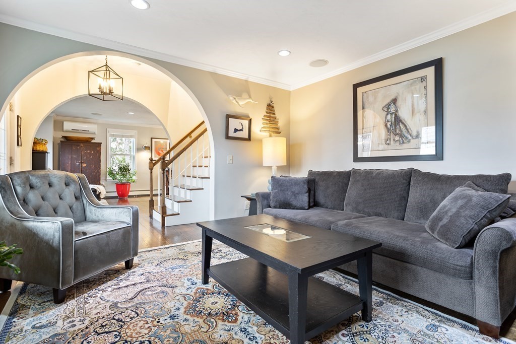 114 River Street Hudson, MA 01749 - Photo 4 of 40 a living room with furniture and a large window