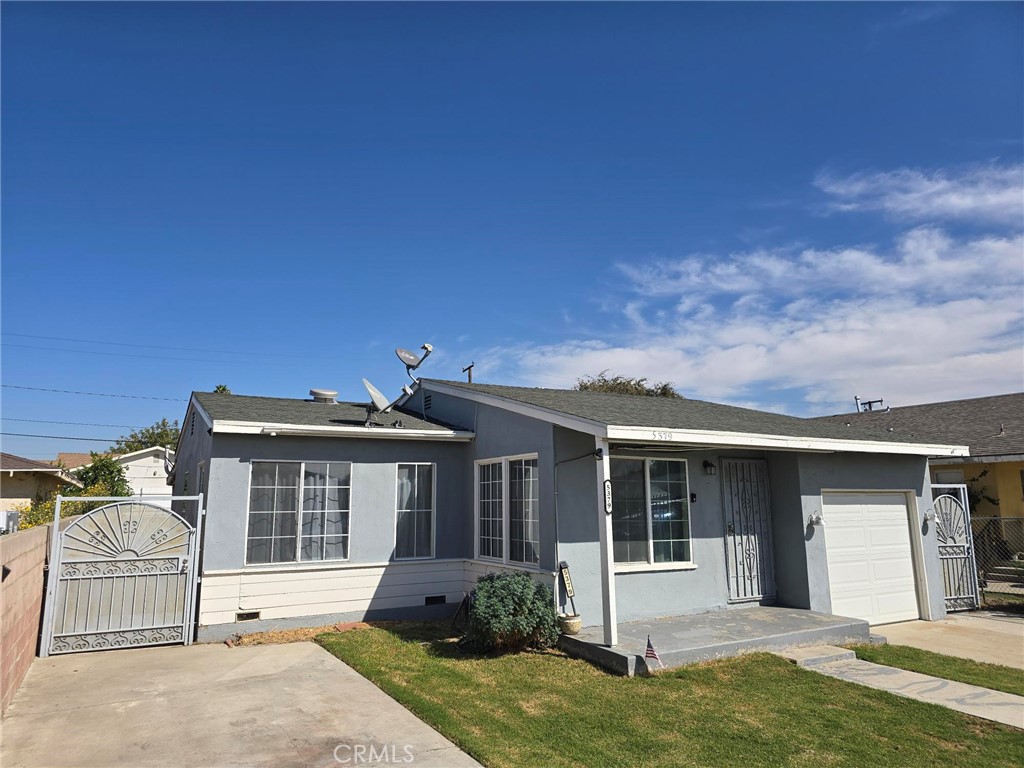 5379 35th Street Riverside, CA 92509 - Photo 2 of 10 front view of a house with a yard