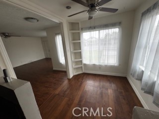 5379 35th Street Riverside, CA 92509 - Photo 5 of 10 a view of an empty room with wooden floor and a window