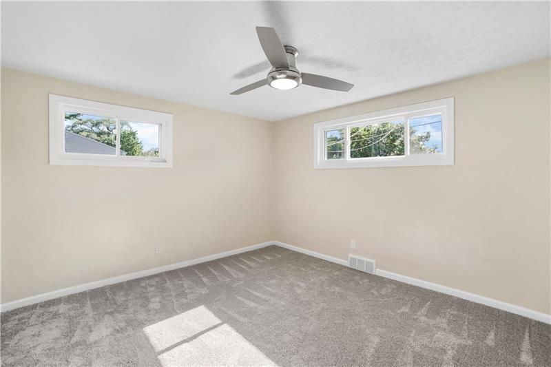 112 Roberts Clairton, PA 15025 - Photo 4 of 8 an empty room with a window and ceiling fan